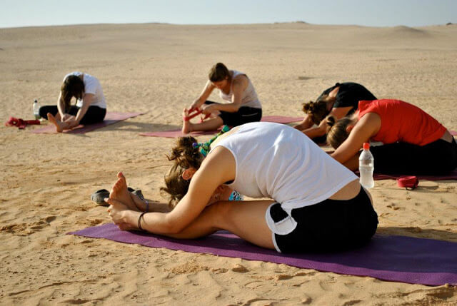 Morning yoga in the dunes with Emma, 2011