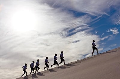 Running up sand dunes