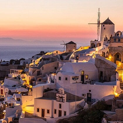 Santorini at sunset on a yoga retreat